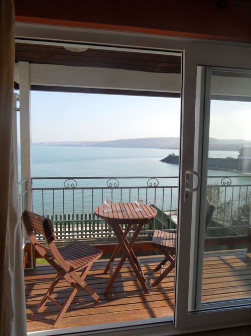 lounge balcony view across Cardigan Bay at 30 Rock Street, a holiday home to let with Harbour Homes